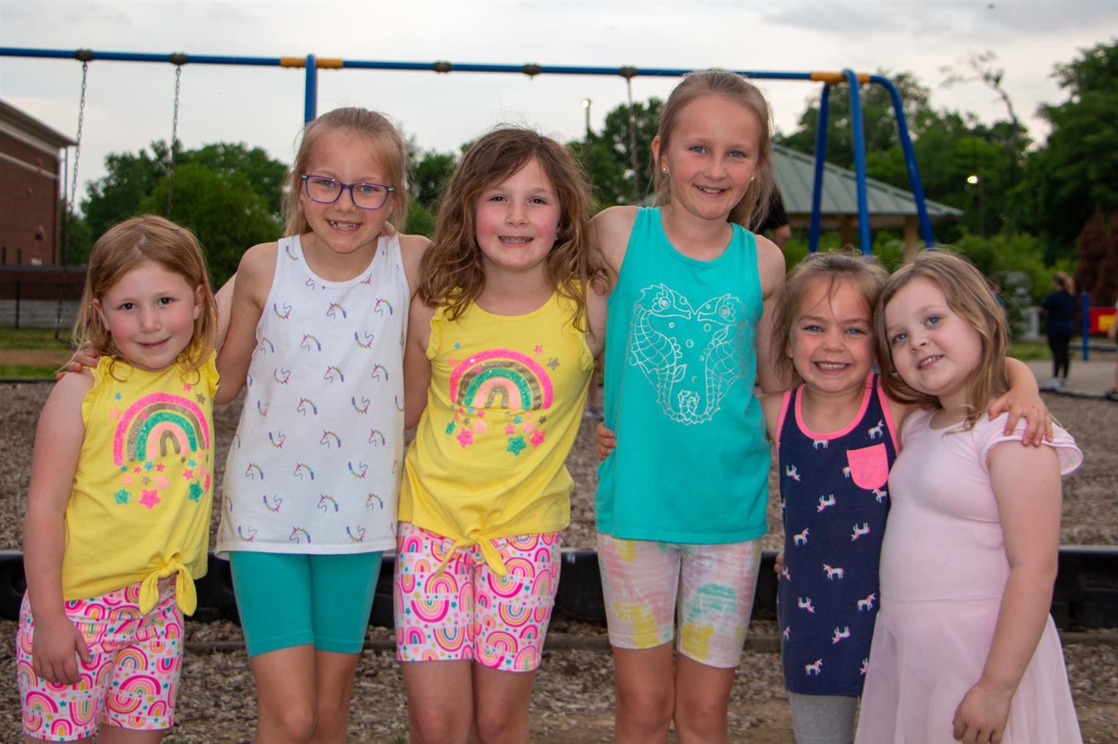 Friends standing in a line on the playground